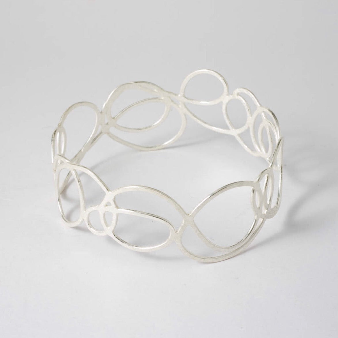 Silver bracelet made from thin swirls