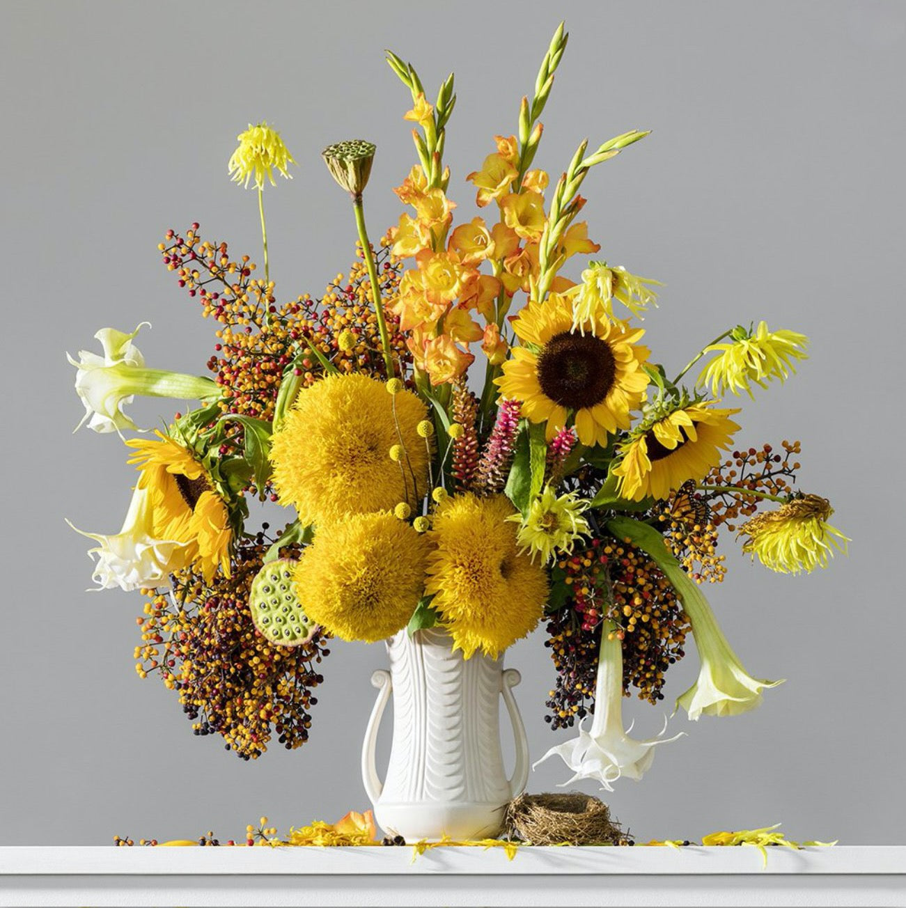 Photograph of a slightly-wilted yellow flower arrangement