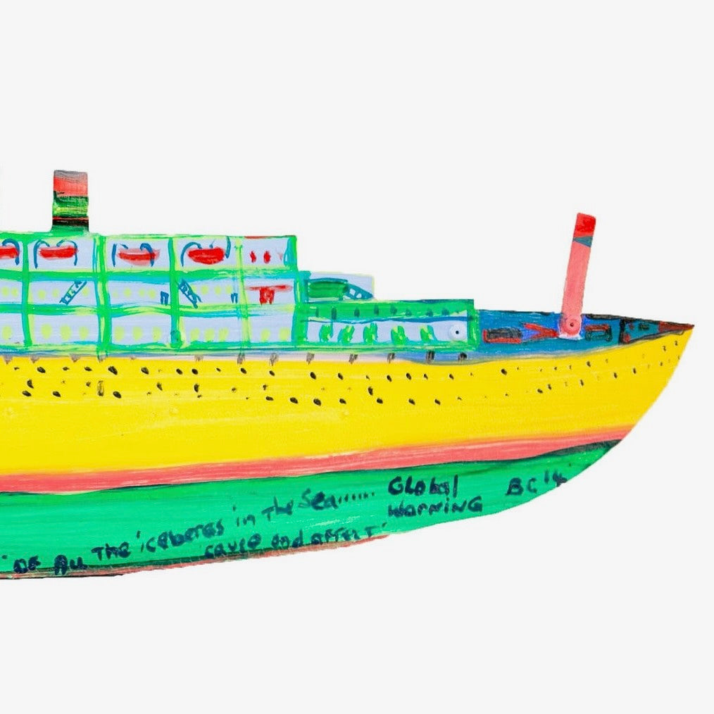 Bow of a brightly coloured ship artwork with writing on the hull.