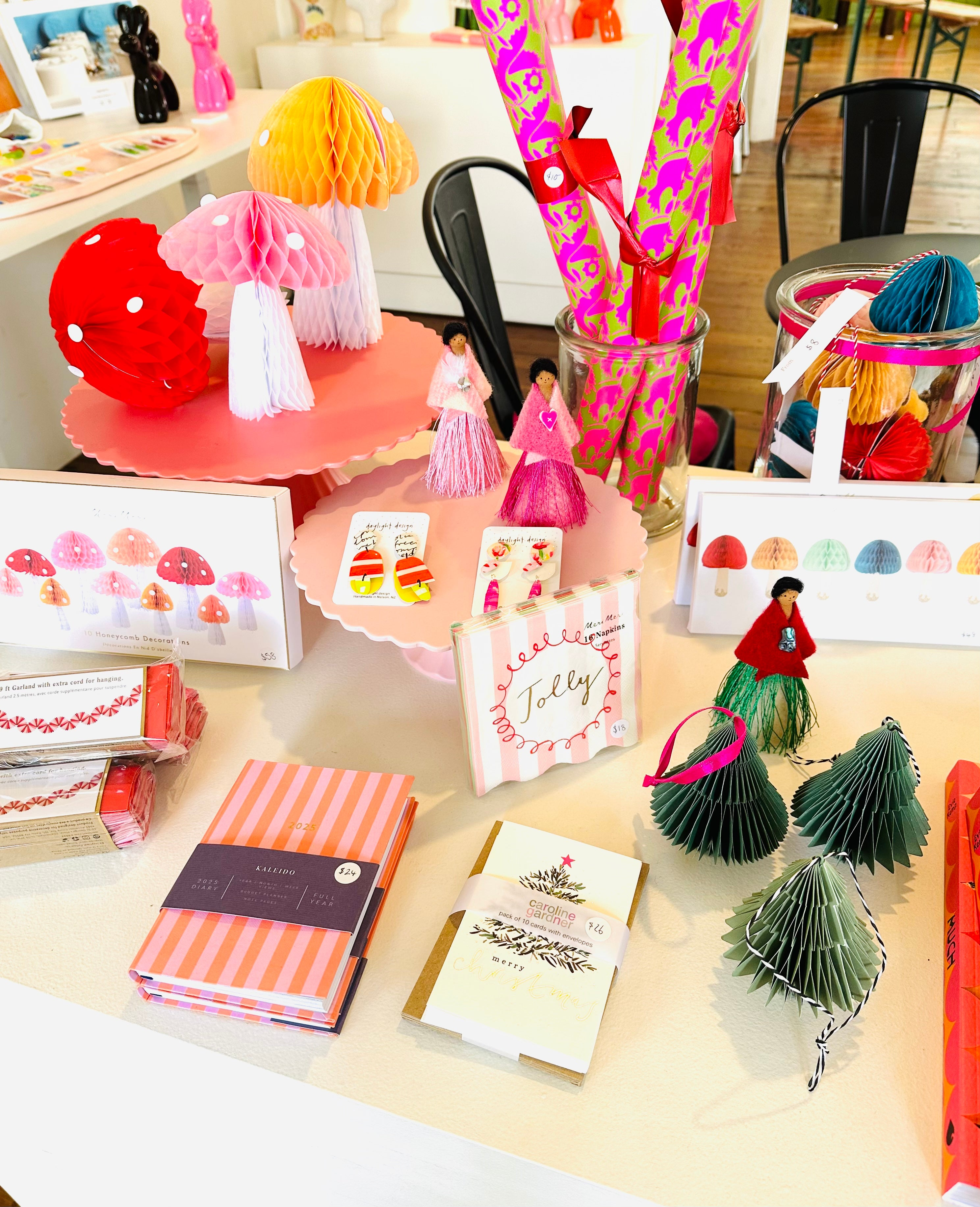 An assortment of festive-themed gifts, including stationery, decorations, gift cards and more.