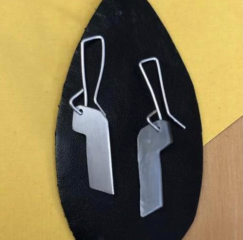 Pair of soft upside-down J-shaped earrings made of silver
