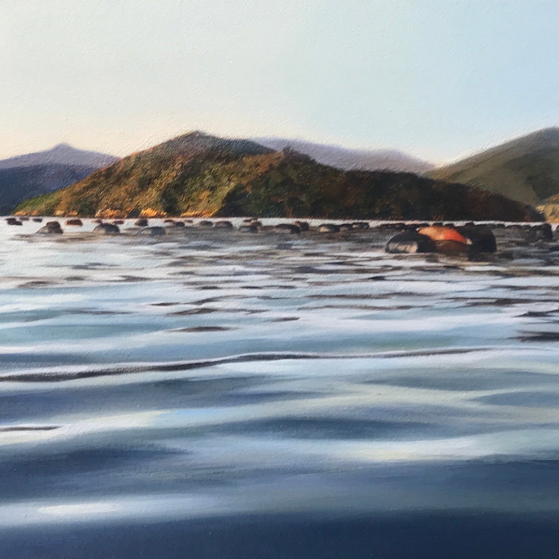 Painting of coastline at sunrise