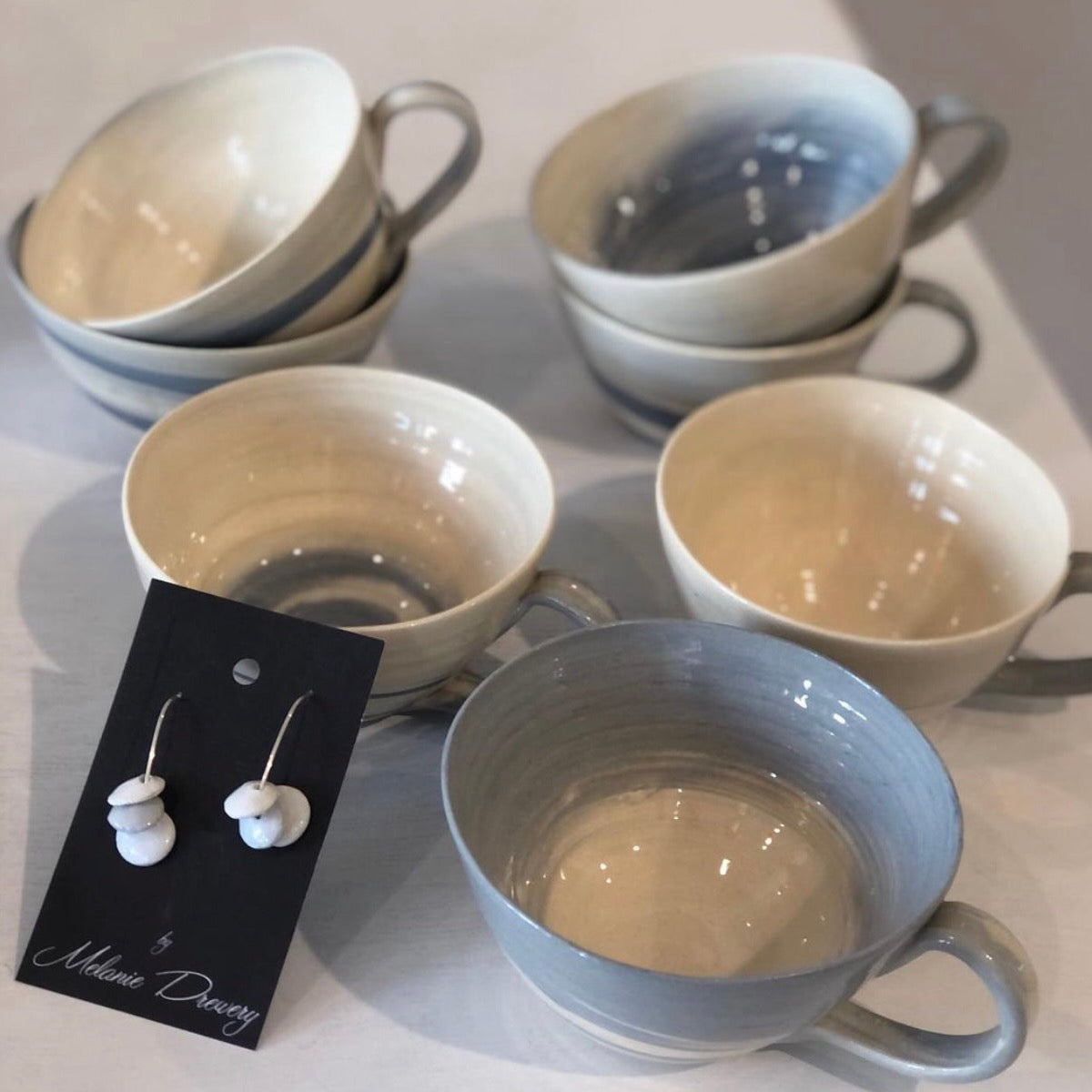 Grey teacups with matching earrings