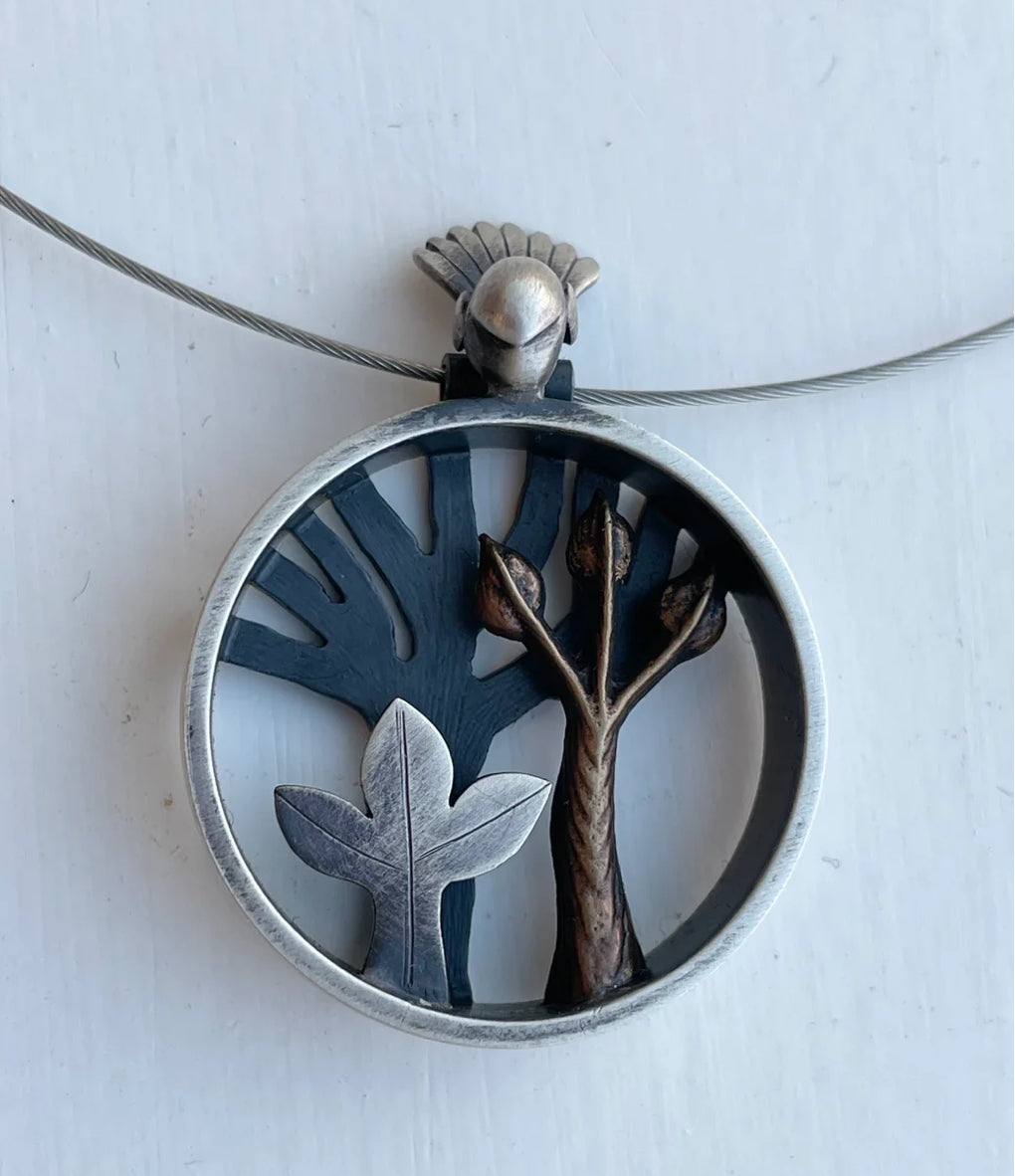 Four necklaces in a row made of silver with different coloured beads