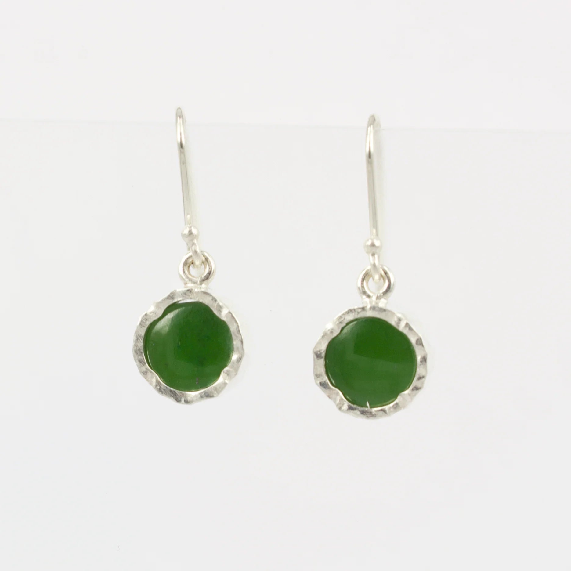 Round pounamu Earrings encased in silver