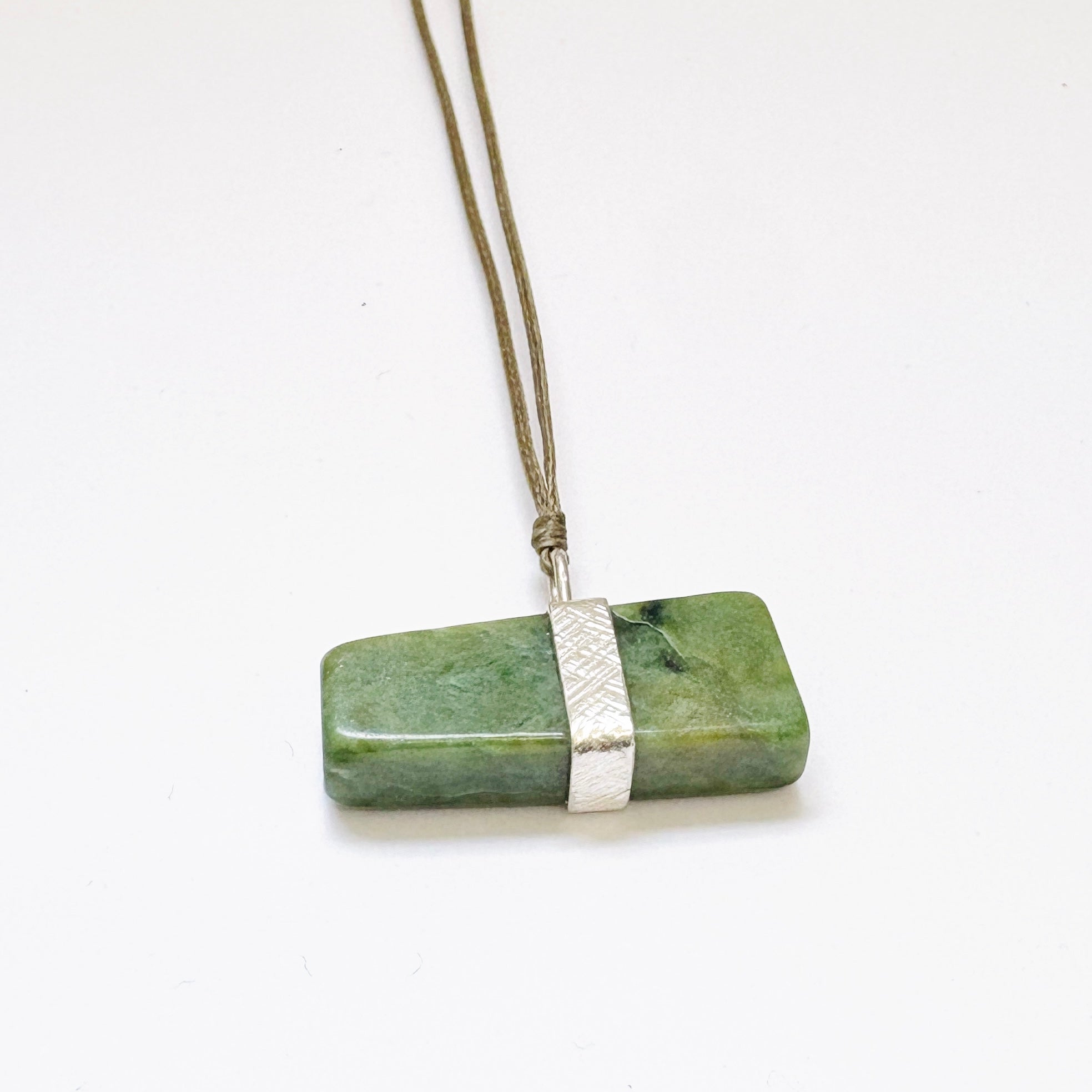 Down to Earth Pounamu necklace on thread